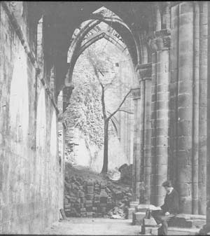 View of the east end of the nave of the church at Kirkstall Abbey showing debris left by the collapse of the tower in 1779. The photograph must have been taken before 1892-6 when this damage was repaired.
