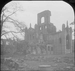 The church of Kirkstall Abbey from the south east with trees in the foreground. The photograph must have been taken before 1892-6.