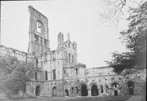 The cloister of Kirkstall Abbey looking north east. Photograph taken prior to the the programme of conservation work in 1892-6.